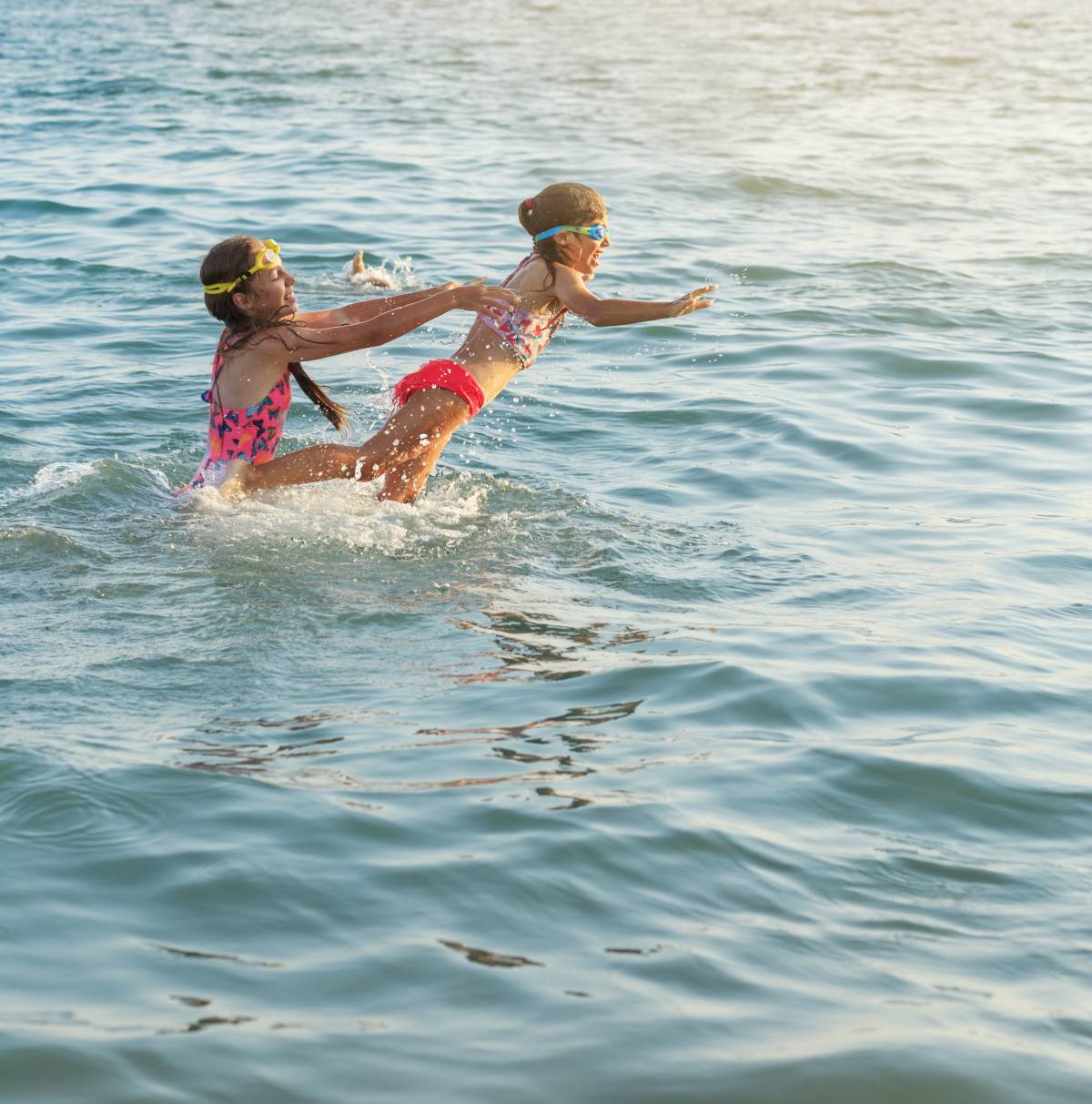 Kids Making a Splash Two kids playing in the water